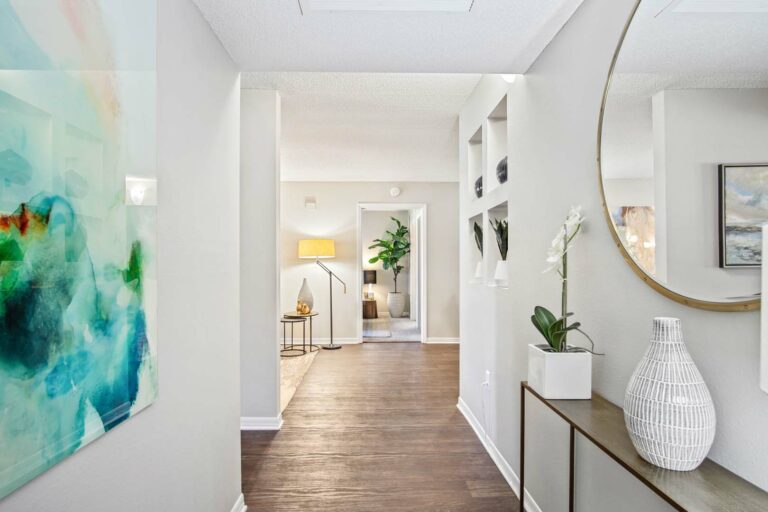 Apartment entrance with hardwood-style flooring and built-in shelving